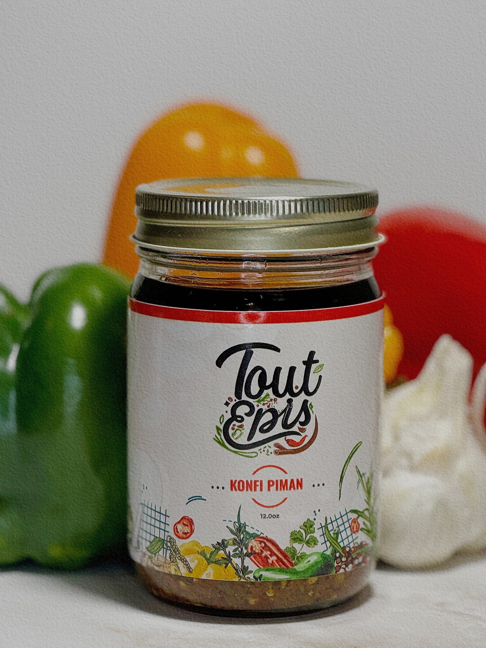 Konfi Piman – Haitian pepper condiment by ToutEpis
Spicy Caribbean chili oil infused with herbs and garlic