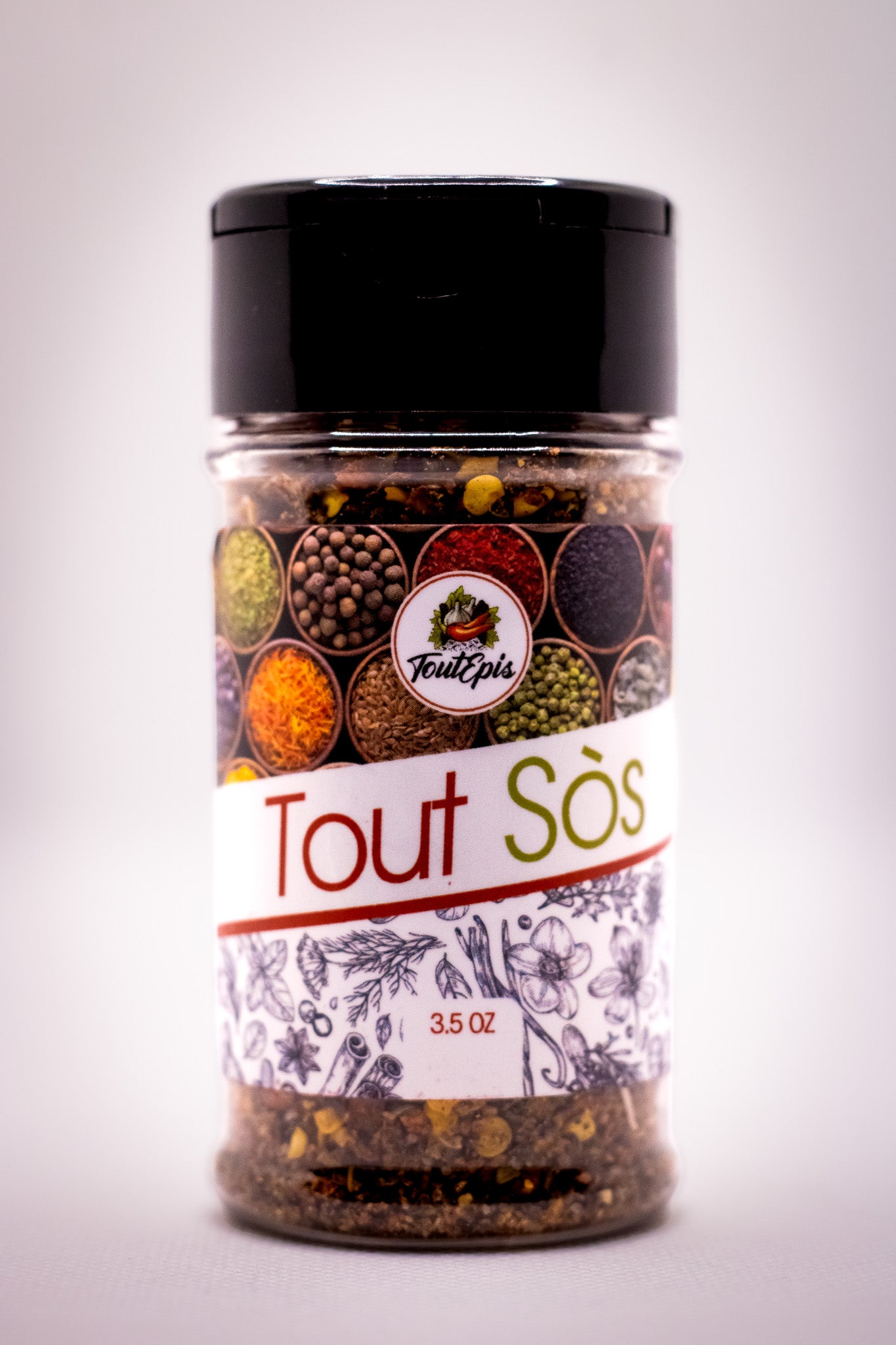 3.5 oz seasoning bottle with Tout Sòs label